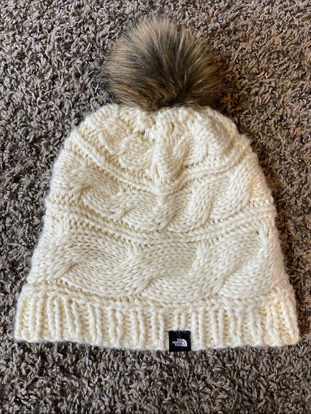 The North Face Ivory Cable Knit Pom Beanie with Faux-Fur Pom